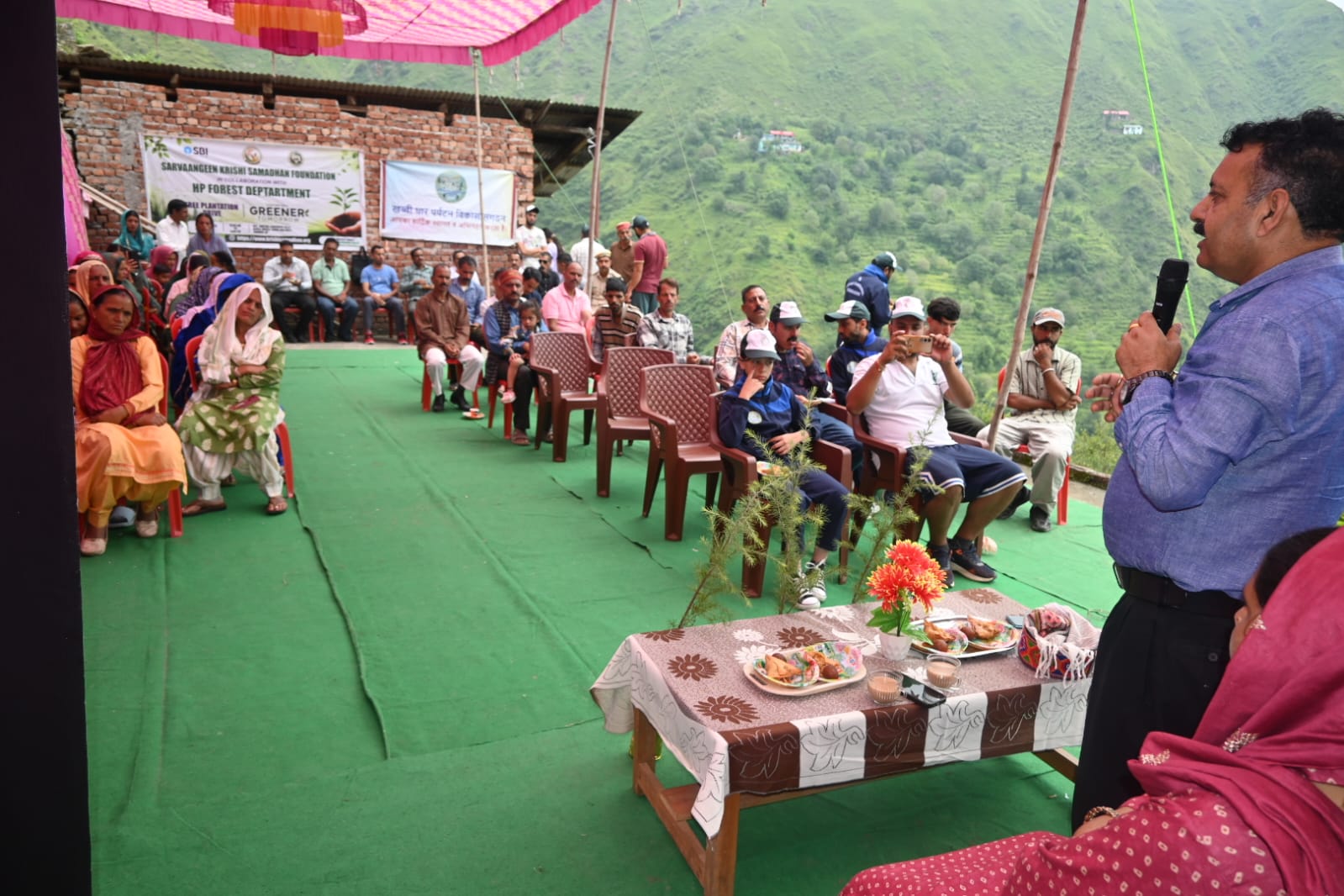 Volunteers planting saplings together
